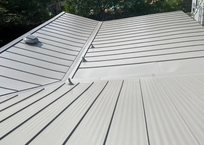 Solar attic fan installed on a metal roof for Roof Ventilation in Valdosta